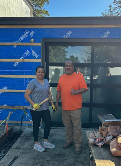 Lau and Milika working on a house